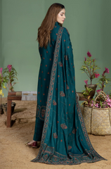 A green suit featuring intricate embroidery and a paisley pattern, showcasing elegance and craftsmanship.
