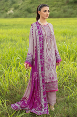 A three-piece lawn suit by Sahil Khan, showcasing detailed embroidery and a colorful pattern, elegantly arranged on a hanger.