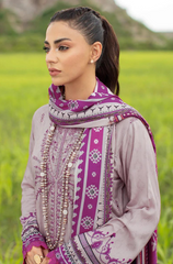  Elegant Sahil Khan three-piece embroidered lawn suit, featuring rich colors and intricate designs, presented on a display stand.
